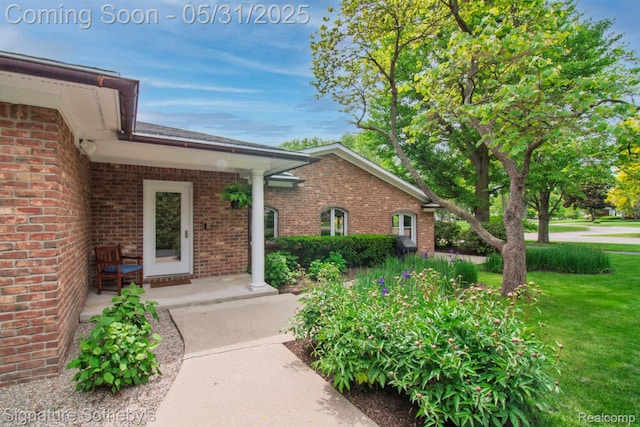 3171 E Breckenridge Ln, Bloomfield Hills, MI 48301 - doorway to property with brick siding and a yard