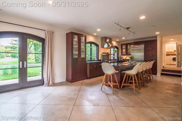 3171 E Breckenridge Ln, Bloomfield Hills, MI 48301 - dining room featuring washer / clothes dryer, french doors, plenty of natural light, light tile patterned floors, and recessed lighting