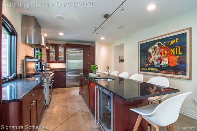 3171 E Breckenridge Ln, Bloomfield Hills, MI 48301 - kitchen featuring high quality appliances, wine cooler, a sink, range hood, and a center island with sink