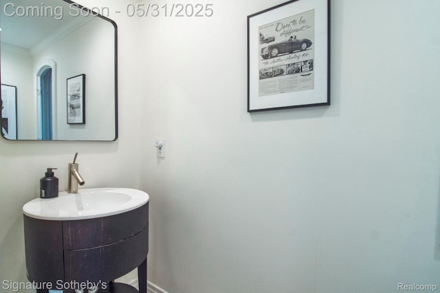 3171 E Breckenridge Ln, Bloomfield Hills, MI 48301 - bathroom featuring crown molding, vanity, and baseboards
