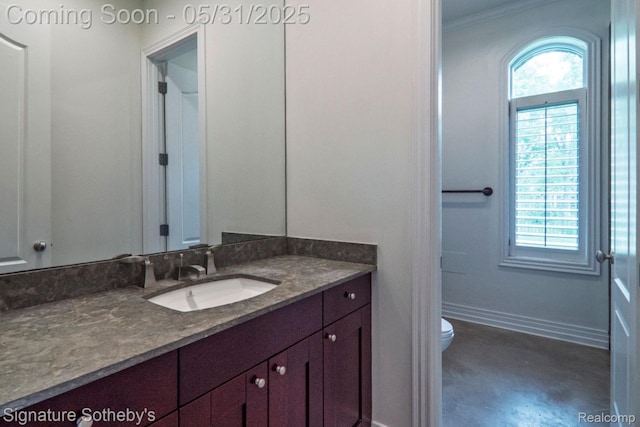 3171 E Breckenridge Ln, Bloomfield Hills, MI 48301 - bathroom with vanity, toilet, healthy amount of natural light, ornamental molding, and baseboards