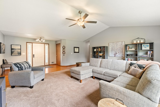 617 Ramsey Ln, Pleasant Lake, MI 49272 - living area with ceiling fan, light colored carpet, vaulted ceiling, light wood-style flooring, and baseboards