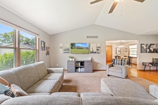 617 Ramsey Ln, Pleasant Lake, MI 49272 - living area featuring lofted ceiling, ceiling fan, and a chandelier