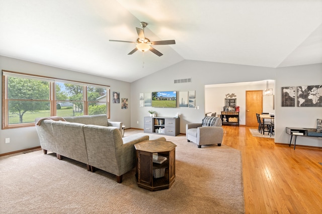 617 Ramsey Ln, Pleasant Lake, MI 49272 - living area featuring vaulted ceiling, ceiling fan, light wood finished floors, and baseboards