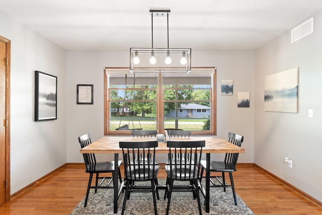 617 Ramsey Ln, Pleasant Lake, MI 49272 - dining room with light wood-type flooring and baseboards