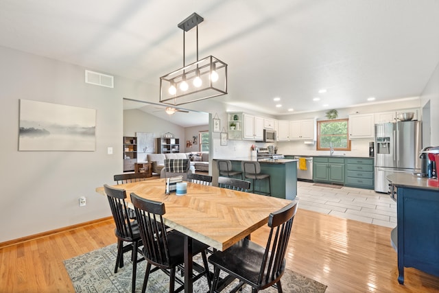 617 Ramsey Ln, Pleasant Lake, MI 49272 - dining area with ceiling fan, light wood-type flooring, recessed lighting, baseboards, and vaulted ceiling