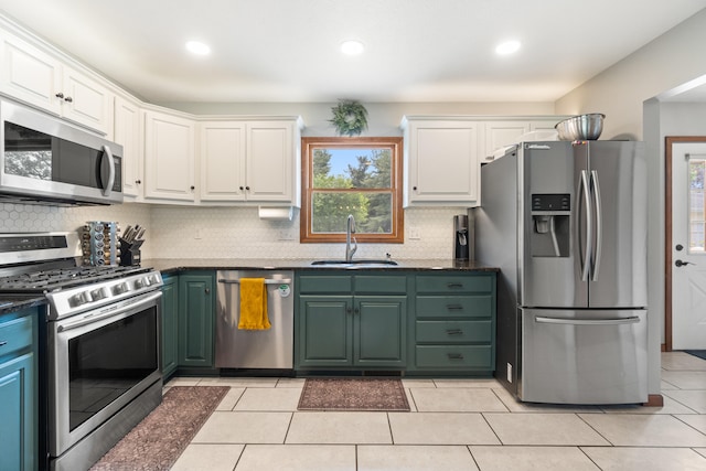 617 Ramsey Ln, Pleasant Lake, MI 49272 - kitchen with appliances with stainless steel finishes, a sink, white cabinetry, backsplash, and recessed lighting