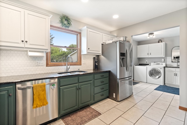 617 Ramsey Ln, Pleasant Lake, MI 49272 - kitchen featuring stainless steel appliances, washer and dryer, a sink, white cabinetry, and recessed lighting