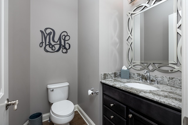 4034 Glacier Lake Ct, Dexter, MI 48130 - bathroom featuring toilet, vanity, and baseboards