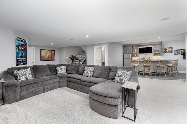 4034 Glacier Lake Ct, Dexter, MI 48130 - carpeted living room featuring bar, recessed lighting, stairway, and baseboards