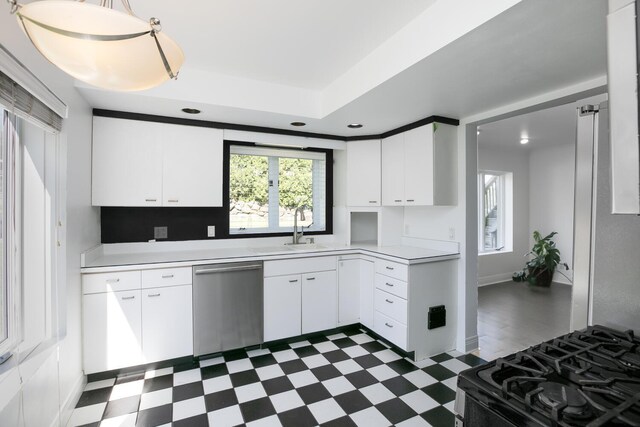 70847 Claire Dr, Union, MI 49130 - kitchen featuring stainless steel dishwasher, dark flooring, a sink, light countertops, and recessed lighting