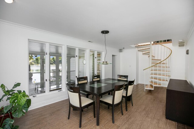 70847 Claire Dr, Union, MI 49130 - dining area with wood finished floors, stairs, ornamental molding, baseboards, and a water view