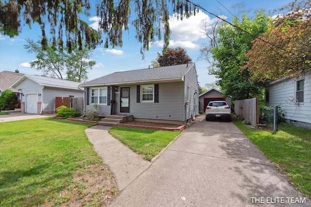 4542 Pinehurst Ave SW, Grand Rapids, MI 49548 - view of front of house featuring driveway, a garage, and an outdoor structure