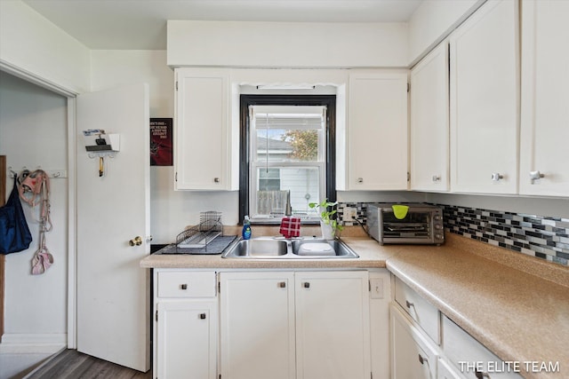 4542 Pinehurst Ave SW, Grand Rapids, MI 49548 - kitchen with white cabinetry and light countertops