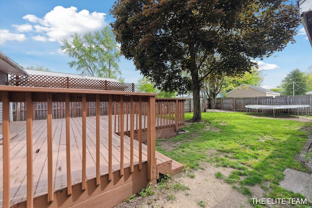 4542 Pinehurst Ave SW, Grand Rapids, MI 49548 - view of yard with a trampoline and a wooden deck