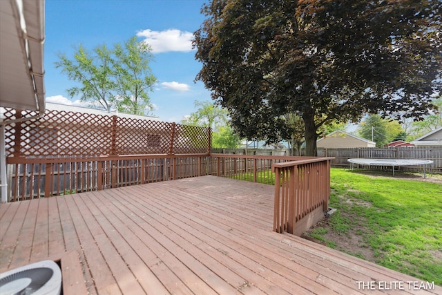 4542 Pinehurst Ave SW, Grand Rapids, MI 49548 - wooden deck with a trampoline