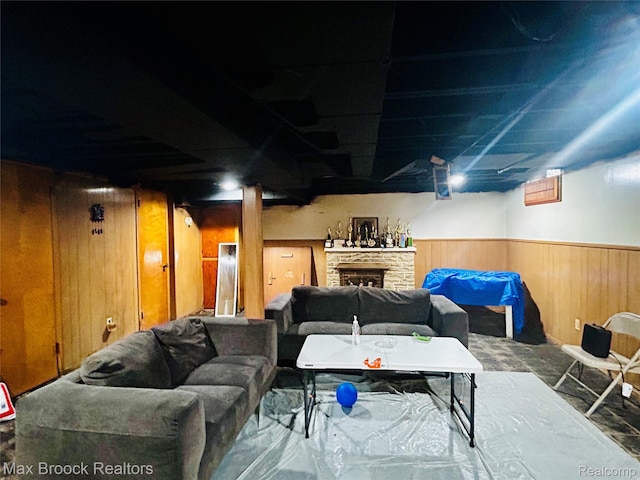 20236 Spencer St, Detroit, MI 48234 - finished below grade area featuring wooden walls, a fireplace, and a wainscoted wall