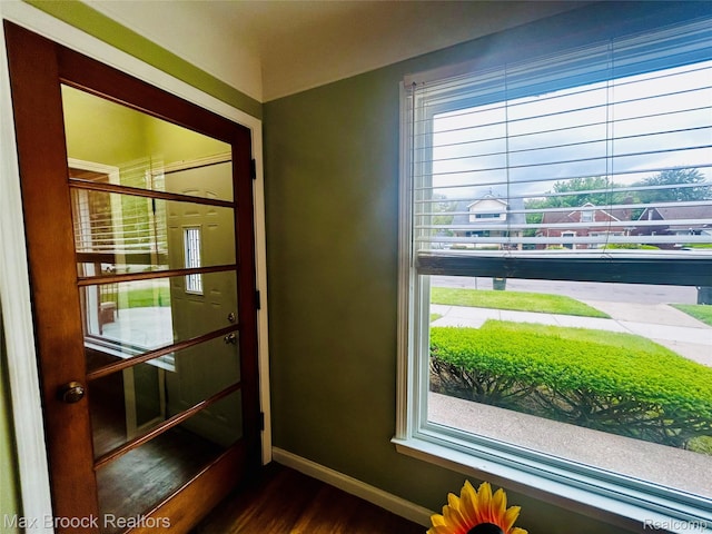 20236 Spencer St, Detroit, MI 48234 - entryway with baseboards and dark wood-style flooring