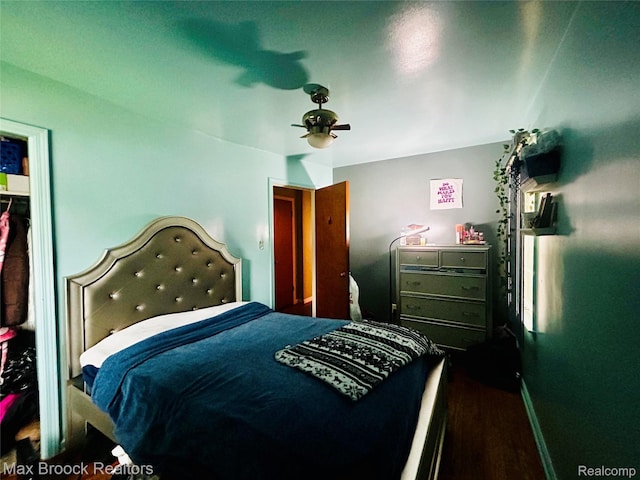 20236 Spencer St, Detroit, MI 48234 - bedroom featuring wood finished floors, a ceiling fan, and baseboards