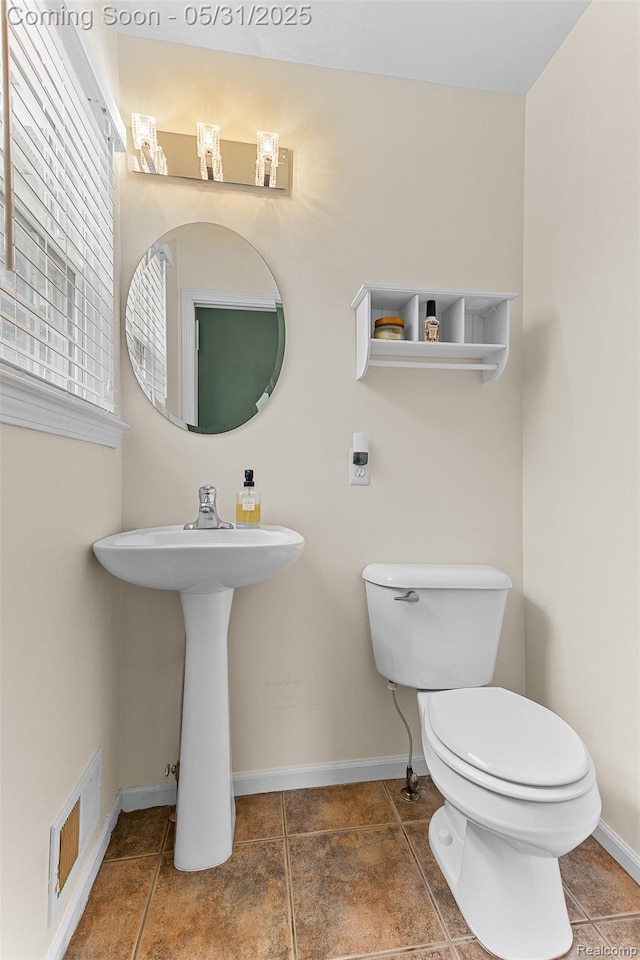 21106 Collingham Ave, Farmington Hills, MI 48336 - half bath featuring toilet, tile patterned floors, baseboards, and a sink