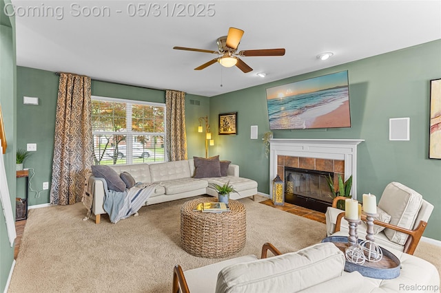 21106 Collingham Ave, Farmington Hills, MI 48336 - living room with a ceiling fan, a tiled fireplace, baseboards, and carpet flooring