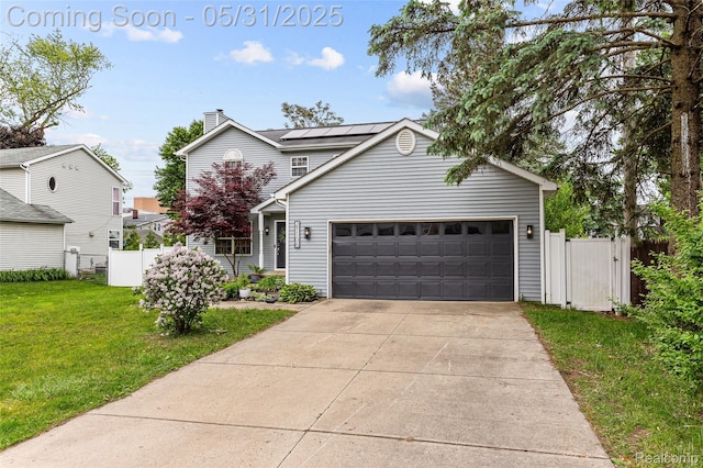 21106 Collingham Ave, Farmington Hills, MI 48336 - view of front facade with solar panels, a garage, concrete driveway, and a chimney