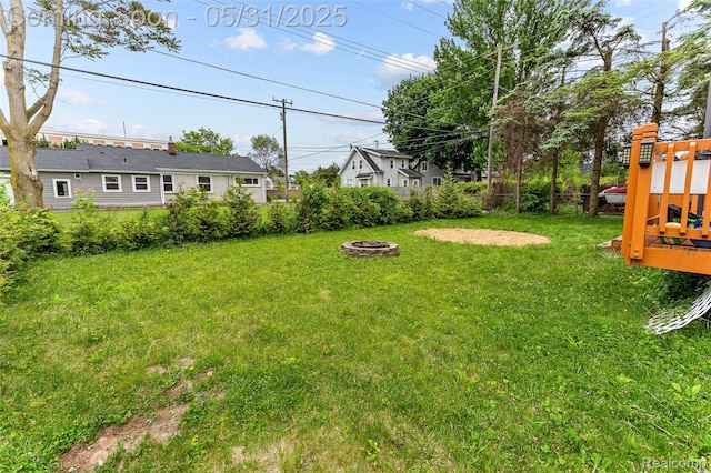 21106 Collingham Ave, Farmington Hills, MI 48336 - view of yard with an outdoor fire pit and a playground