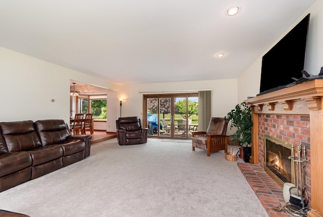 3677 W White Trillium Dr, Saginaw, MI 48603 - living room featuring carpet floors, healthy amount of natural light, and a fireplace
