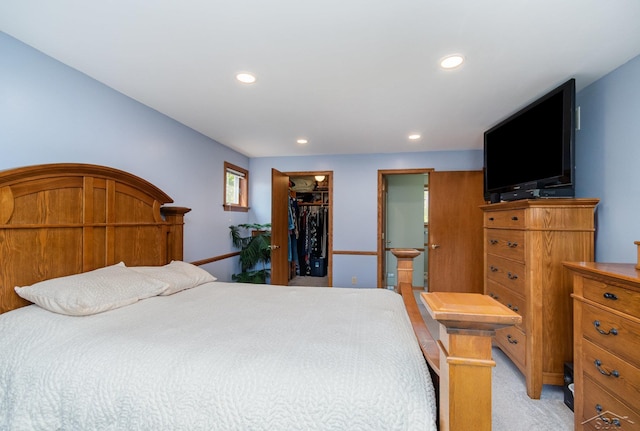 3677 W White Trillium Dr, Saginaw, MI 48603 - bedroom featuring recessed lighting, a walk in closet, a closet, light carpet, and ensuite bath