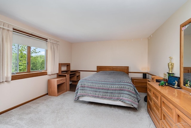 3677 W White Trillium Dr, Saginaw, MI 48603 - bedroom with light colored carpet and baseboards