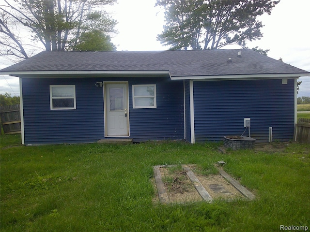 7499 Burt Rd, Birch Run, MI 48415 - rear view of property featuring a shingled roof