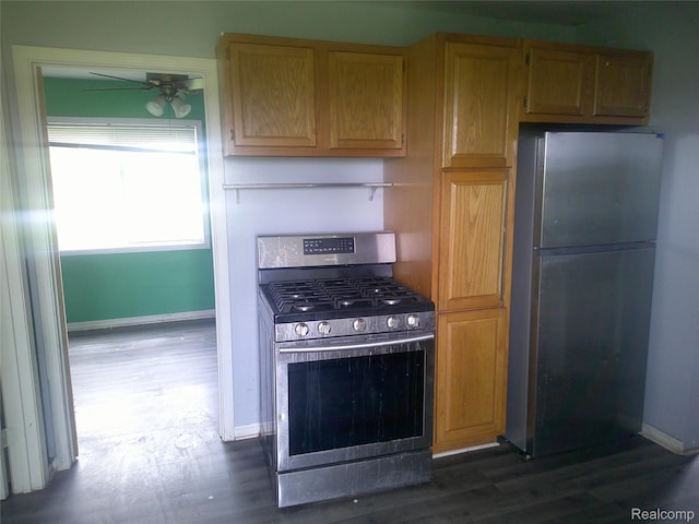 7499 Burt Rd, Birch Run, MI 48415 - kitchen featuring stainless steel appliances, baseboards, dark wood-type flooring, and ceiling fan