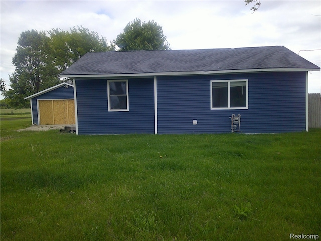 7499 Burt Rd, Birch Run, MI 48415 - view of home's exterior featuring a yard and a shingled roof