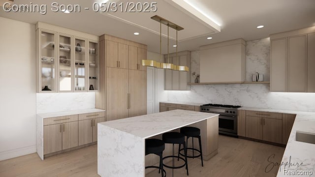 2717 Turtle Shores Dr, Bloomfield Hills, MI 48302 - kitchen with high end stove, light wood finished floors, backsplash, light stone countertops, and recessed lighting
