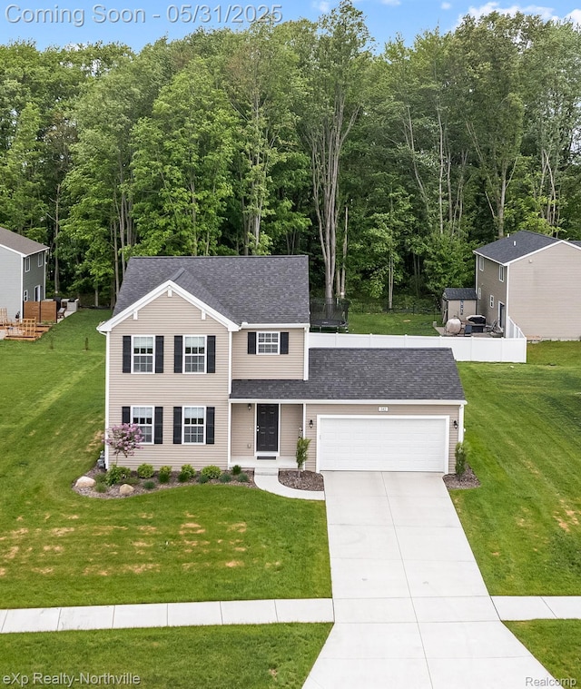 342 Lotz Ct, Wayland, MI 49348 - view of front of property with an attached garage, a front lawn, a shingled roof, and concrete driveway