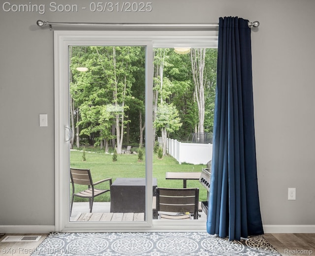 342 Lotz Ct, Wayland, MI 49348 - doorway featuring baseboards and wood finished floors