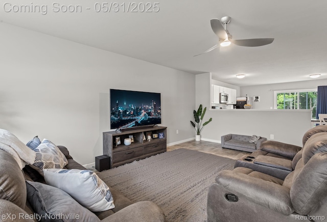 342 Lotz Ct, Wayland, MI 49348 - living area with a ceiling fan, baseboards, and wood finished floors