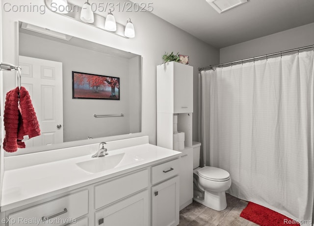 342 Lotz Ct, Wayland, MI 49348 - full bath with vanity, toilet, wood finished floors, and a shower with curtain