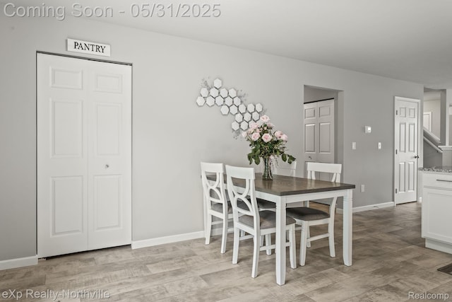 342 Lotz Ct, Wayland, MI 49348 - dining room with light wood-style floors and baseboards