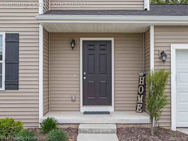 342 Lotz Ct, Wayland, MI 49348 - view of exterior entry with a shingled roof