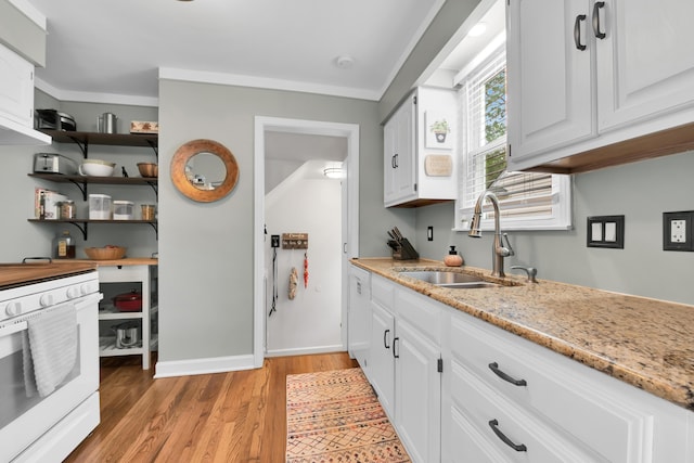 3822 Polk St, Dearborn, MI 48124 - kitchen featuring a sink, white range with electric cooktop, light wood finished floors, white cabinetry, and light stone countertops