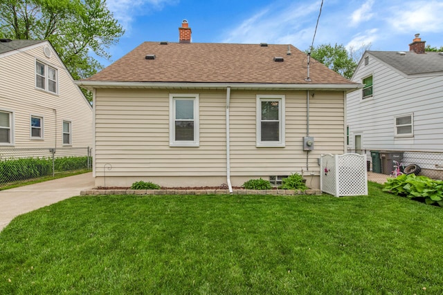 3822 Polk St, Dearborn, MI 48124 - back of property with a chimney and roof with shingles