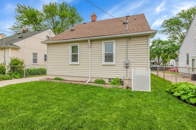 3822 Polk St, Dearborn, MI 48124 - rear view of property featuring a chimney and roof with shingles