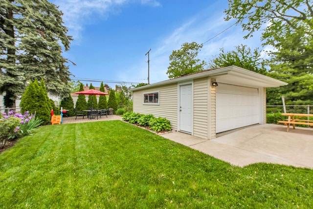 3822 Polk St, Dearborn, MI 48124 - view of yard featuring an outbuilding, a detached garage, and a patio area
