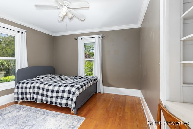 331 Carlton Ave SE, Grand Rapids, MI 49506 - bedroom with wood finished floors, baseboards, ornamental molding, and ceiling fan