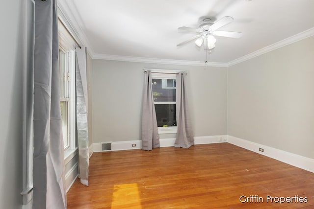 331 Carlton Ave SE, Grand Rapids, MI 49506 - empty room with ceiling fan, ornamental molding, light wood-style floors, and baseboards