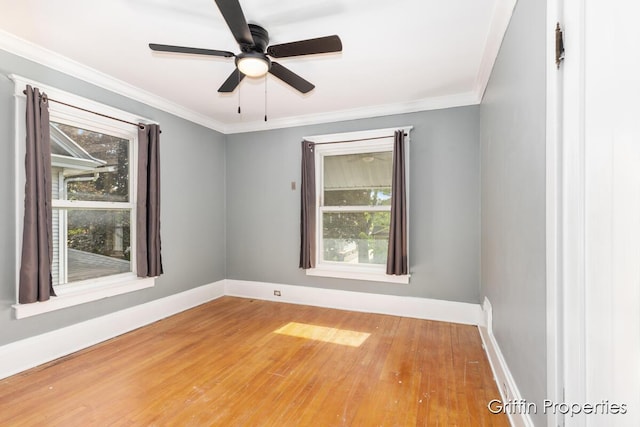 331 Carlton Ave SE, Grand Rapids, MI 49506 - unfurnished room featuring baseboards, wood finished floors, a ceiling fan, and ornamental molding