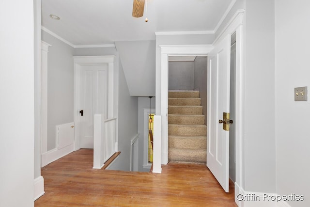 331 Carlton Ave SE, Grand Rapids, MI 49506 - staircase with wood finished floors and ornamental molding