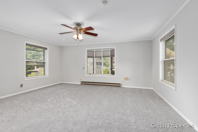 331 Carlton Ave SE, Grand Rapids, MI 49506 - carpeted spare room featuring a baseboard radiator, ornamental molding, a ceiling fan, and baseboards
