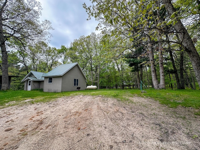 4307 N Mac Rd, Irons, MI 49644 - view of property exterior with a metal roof